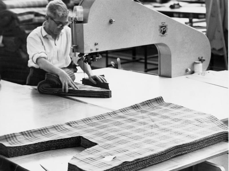 Ton Ginley uses a knife band cutter at Weaver to Wearer in October 1963.