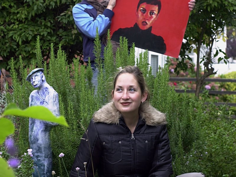 Artist Norrie Hardman and ceramic artist Rebecca Appleby display their work in the garden of neighbour Chris Garbutt in Stainburn Terrace in October 2002.