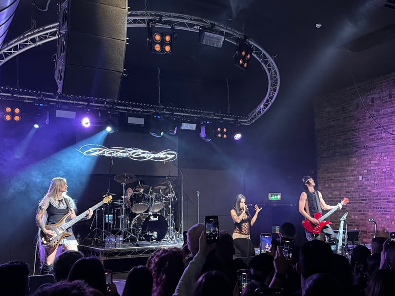 The singer was backed by a three-piece band.