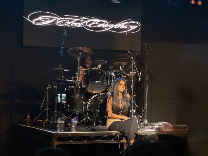 Lindemann takes a seat for the quieter section of the show.