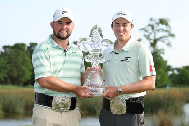 Alex Fitzpatrick and Matt Fitzpatrick pose with the trophy on the 18th green after winning the Zurich Classic of New Orleans 2026 at TPC Louisiana on April 26, 2026 in Avondale, Louisiana. (Photo by Stacy Revere/Getty Images)