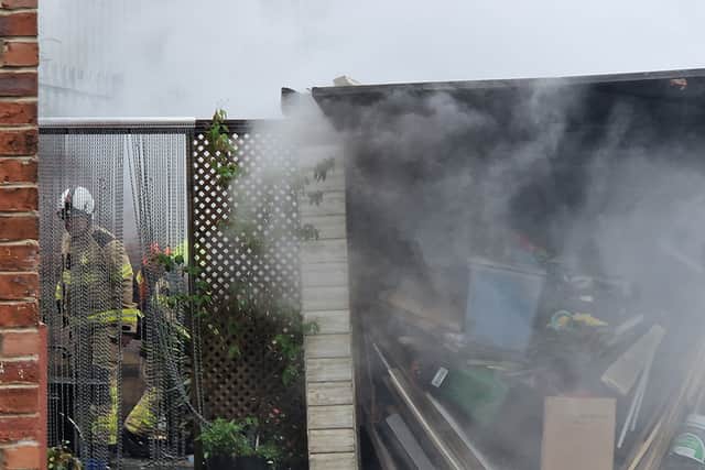 File picture shows a firefighter in action in Sheffield. Photo: David Kessen, Iconic Media