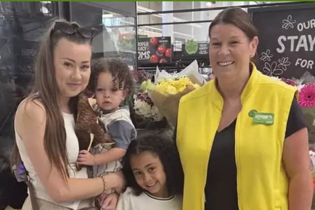Asda worker Sonia Bibby in the Sheffield Handsworth store met up again with one-year baby Makiah Khan whose life she saved when he choked on some food by one of the tills. Also pictured are his mum, Ashleigh, and sister, Malicah. Photo: Asda