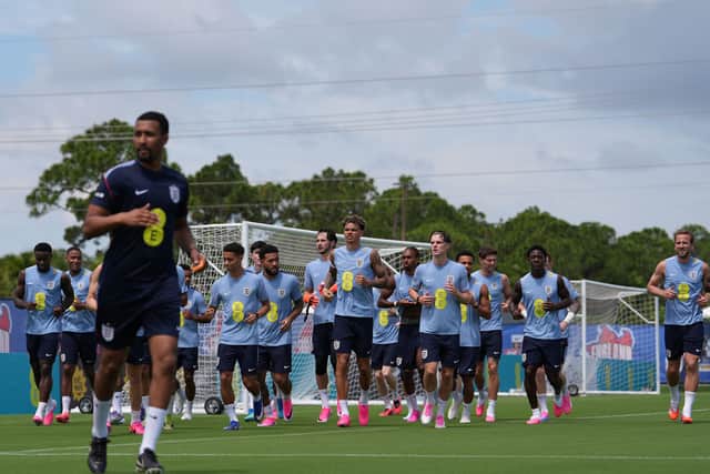 England players jog during a training session for the national soccer team in Palm Beach Gardens, Fla., Tuesday, June 2, 2026, ahead of the World Cup soccer tournament. (AP Photo/Rebecca Blackwell)