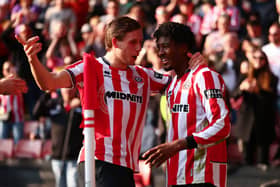Sheffield, England, 21st March 2026. Andre Brooks of Sheffield United celebrates with Sydie Peck of Sheffield United after scoring to make it 1-0 during the Sheffield United vs Wrexham Sky Bet Championship match at Bramall Lane, Sheffield. Picture credit should read: Jake Youle / Sportimage