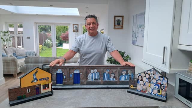 Damien Kennedy poses with his Sheffield Wednesday-themed models.
