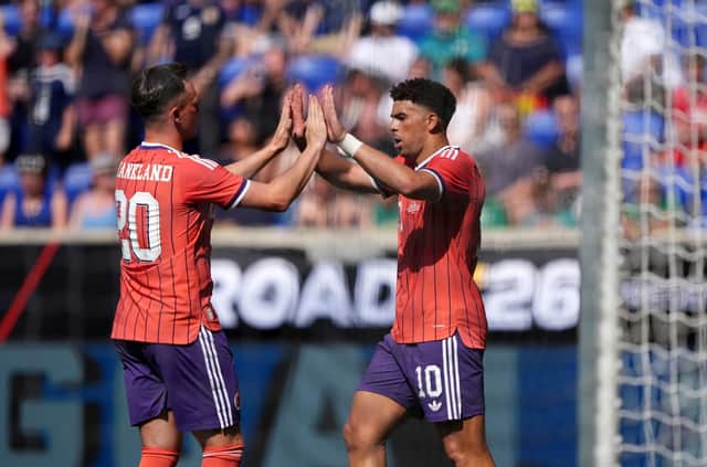 Scotland's Che Adams (right) celebrates with Lawrence Shankland after scoring his sides third goal during the international friendly match at the Sports Illustrated Stadium in Harrison, New Jersey. Andrew Milligan/PA Wire.