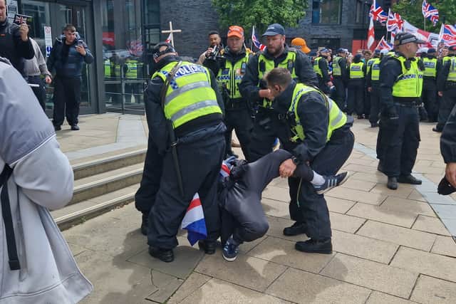 A scuffle breaks out during the Raise the Colours march through Sheffield. Photo: Iconic Media