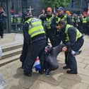 A scuffle breaks out during the Raise the Colours march through Sheffield. Photo: Iconic Media