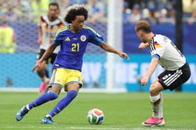 Tahith Chong (left) started Curaçao’s 7-1 defeat to Germany.