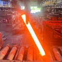 Steel is extracted from the furnace at approximately 1,200°C in preparation for hot rolling.
