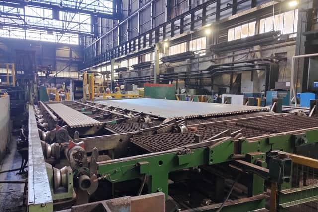Stainless steel being processed on the peeling line in the Bright Bar section in Rotherham, part of Speciality Steel UK.