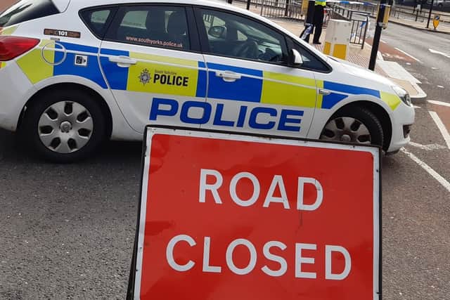 File picture shows police at a road closure. Photo: David Kessen, Iconic Media