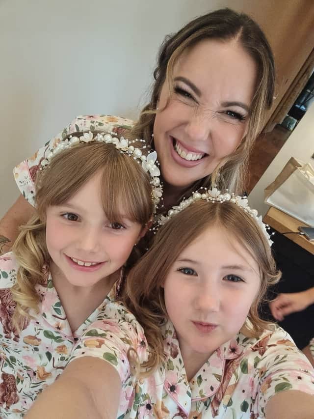 Claire Creighton with her two girls, aged nine
