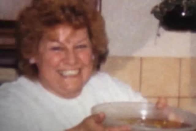 The only item taken from her home was a black leather purse containing a small amount of money