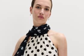 The new M&S Polka Dot Scarf Detail Top combines two of this season's biggest fashion trends in one versatile design