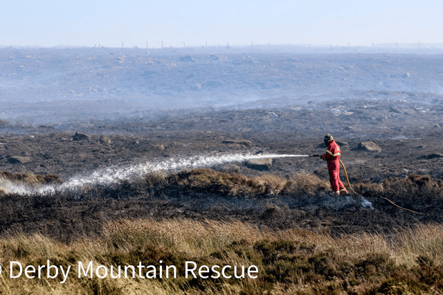 Firefighters dealing with the fire on Tintwistle Moor. Photo: Derby Mountain Rescue