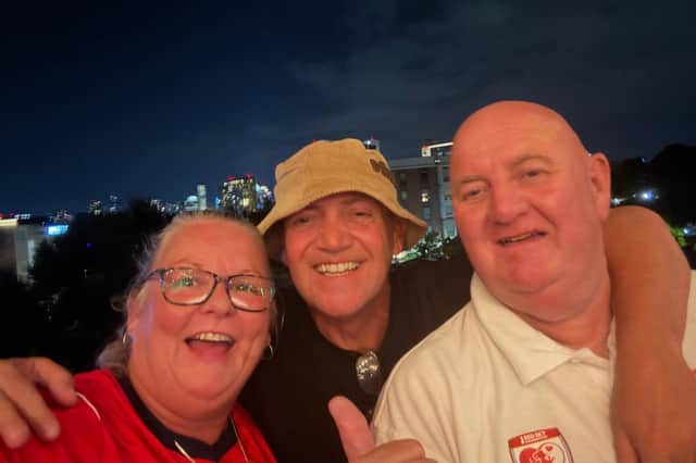 Sheffield Wednesday superfan Tango (right), with partner Rachel and a friend in the US.