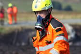 Officer in breathing gear.