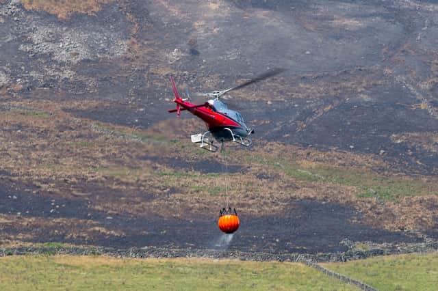 Fire helicopters tackling the wildfire in the Peak District