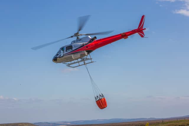 Fire helicopters tackling the wildfire in the Peak District