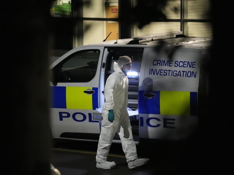 A scenes of crime officer outside All Saints Catholic High School on Granville Road, Sheffield (Danny Lawson/PA)