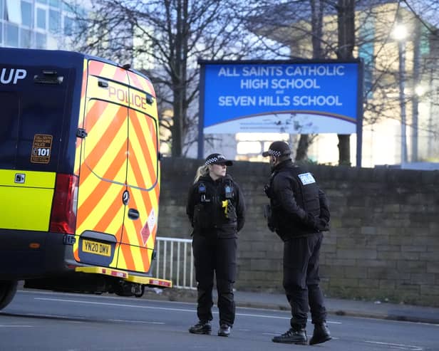 Police officers outside All Saints Catholic High School after the murder of Harvey Willgoose. (Photo: Danny Lawson/PA)