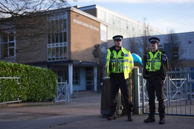 Police officers outside All Saints Catholic High School, on Granville Road in Sheffield, after Harvey Willgoose was stabbed to death(Jacob King/PA)