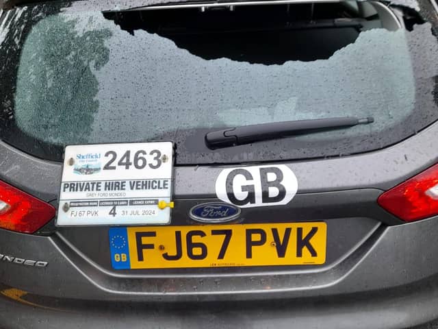 One photo shows his vehicle with a smashed rear window following an incident in Parson Cross.