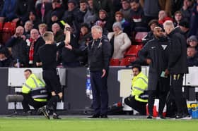 Chris Wilder (centre) has previously criticised Gavin Ward (left).