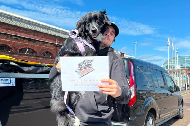 Returning Sheffield Steeler Brandon Whistle arriving back in the UK with dog Aspen