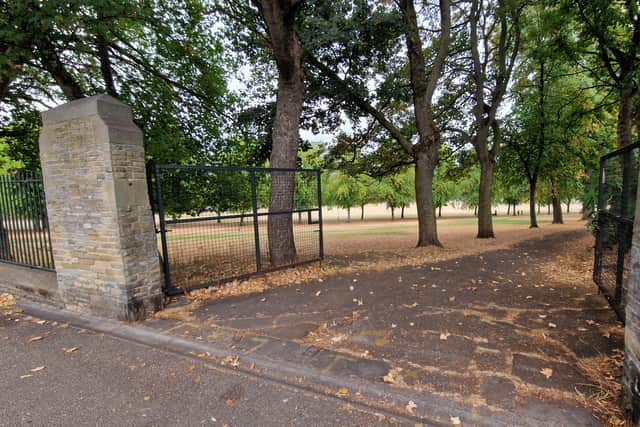 Double gates on a vehicular entrance to Hillsborough Park on Middlewood Road are open after travellers left.