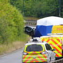Police officers at the scene of a fatal crash involving a police car and a Volkswagen Passat on the A66 in South Bank, near Middlesbrough. Credit: Owen Humphreys/PA Wire