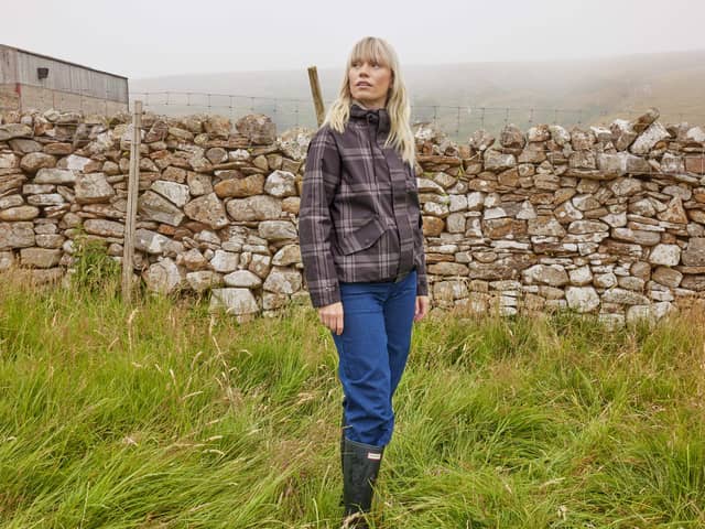 TOG24's Autumn/Winter 26 collection combines classic trench coat styles, along with pieces that are a little different. Pictured is the Ortega Checked Waterproof Coat.