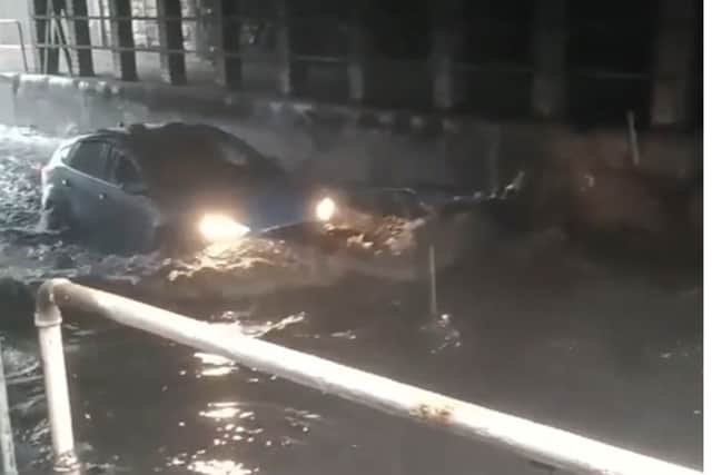 Driver braves floodwaters at notorious Upwell Street. Pictures and video by Mr Mariusz.
