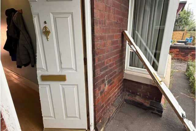 Police gained entry by slicing the front door in half from top to bottom