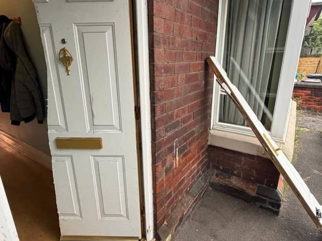 Police gained entry by slicing the front door in half from top to bottom
