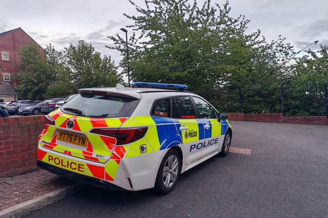 A police car on Holywell Heights