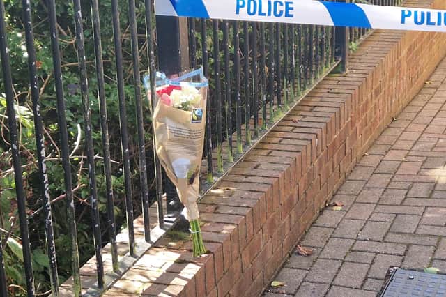 A bouquet of pink and white flowers have been left outside the property on Holywell Heights, Wincobank.