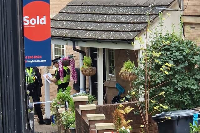 Police continue to guard a home on Holywell Heights in Wincobank after a newborn baby was murdered