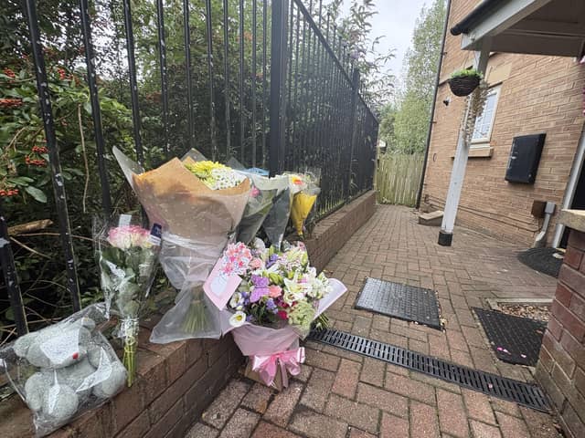 Flowers left at the scene in Holywell Heights, Sheffield