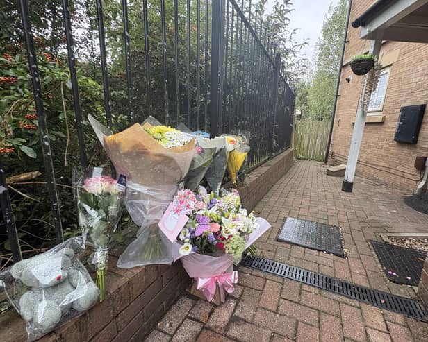 Flowers left at the scene in Holywell Heights, Sheffield