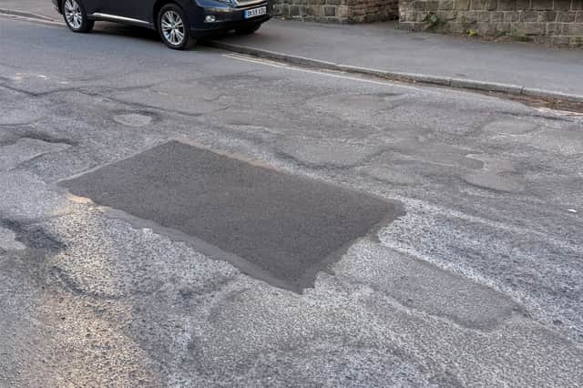 Osborne Road has been repaired several times but has potholes.