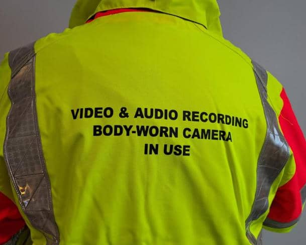 A high visibility vest is pictured stating video and audio recording is in use. This follows the council's announcement that school crossing patrol wardens will be given body-worn cameras to improve safety.