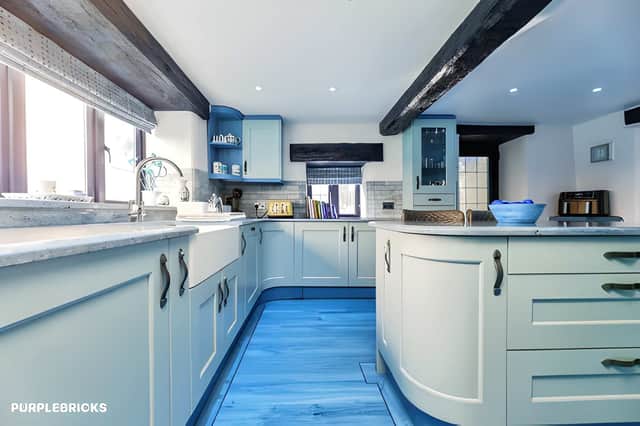 The property's contemporary finish sits alongside traditional details, creating a refined country-home feel