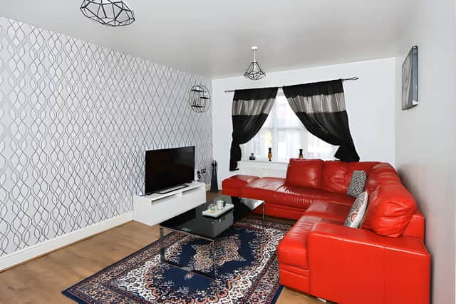 A stylish living room forms part of the bright and welcoming ground-floor accommodation