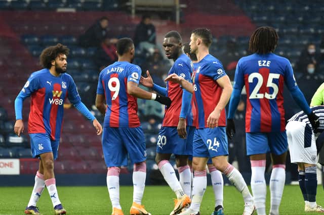 Jordan Ayew played with Jaïro Riedewald (left) at Crystal Palace.