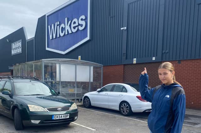 Rachel Armitage's daughter at the Wickes car park where Rachel was asked to pay a £100 fine for picking up her sons. Photo: Rachel Armitage