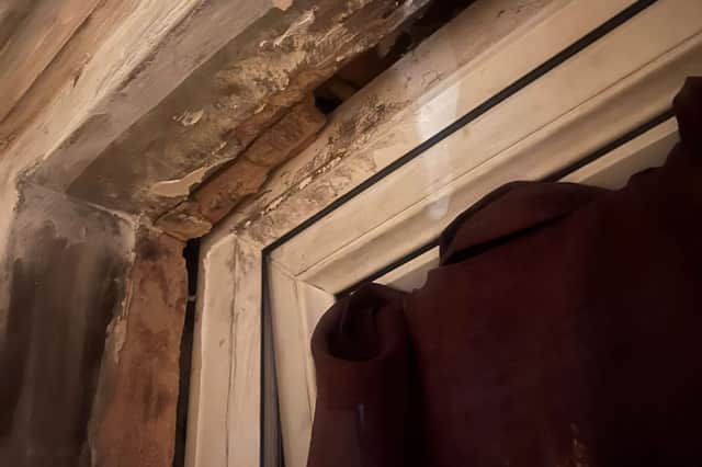 A damaged window frame at a house council in Sheffield - the tenant says she has tried unsuccessfully to get repairs done for 15 years