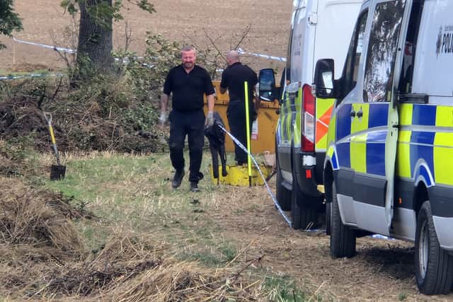 Officers dig out a pond in a field in Aston in the search for Teresa Shephard.